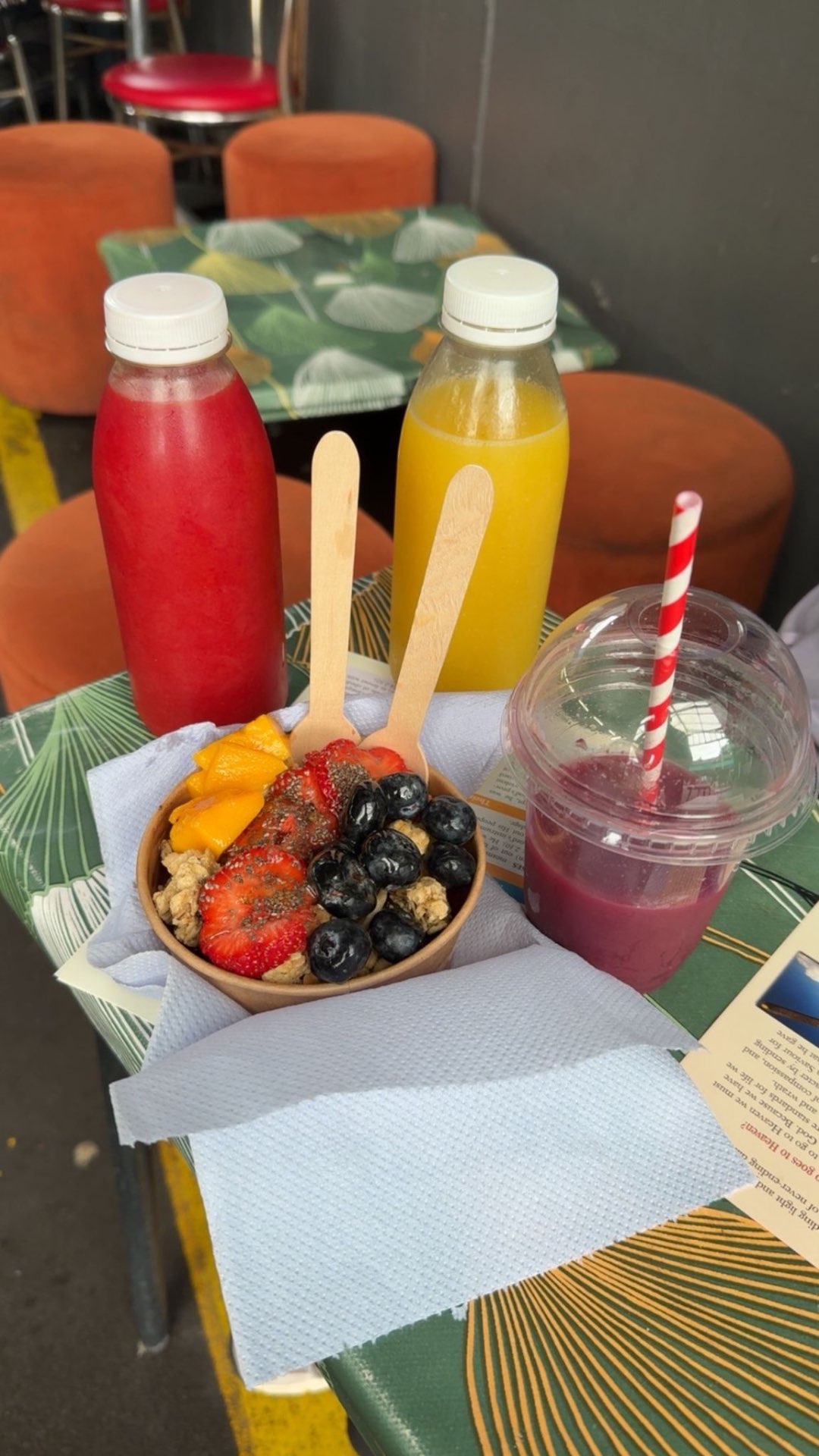 Cold-pressed juice splashes with fresh fruit